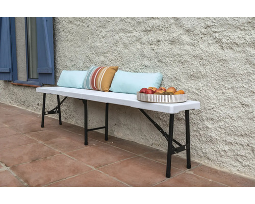Banc pliant avec coussins et coupe de fruits pour le jardin