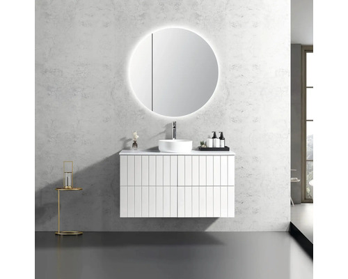 Salle de bains moderne avec meuble-lavabo, miroir rond avec éclairage et robinet.
