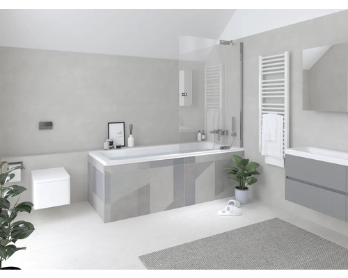 Salle de bains lumineuse avec baignoire, lavabo, radiateur et toilettes dans un design moderne.