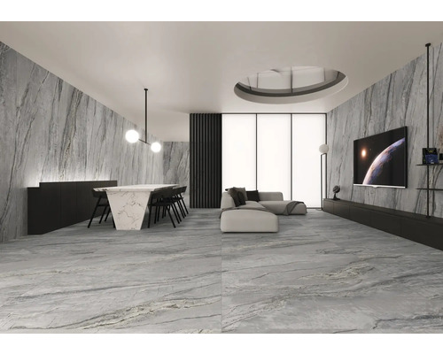 Espace de vie lumineux avec murs en marbre, table à manger et télévision pour une ambiance moderne.