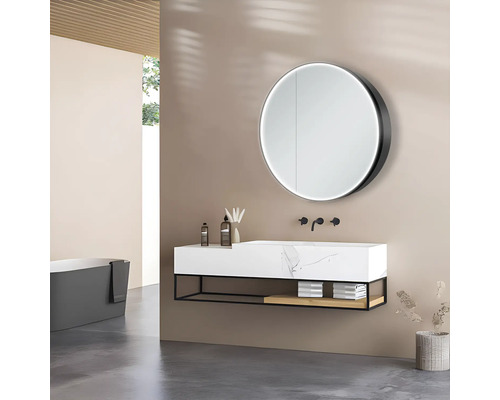 Salle de bain moderne avec lavabo, miroir rond et baignoire