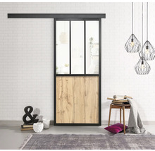 Schiebetür mit Glas- und Holzpaneelen vor einer weissen Ziegelwand