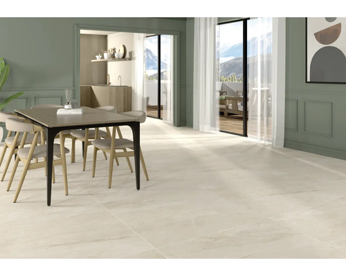 Pièce lumineuse avec table à manger et carrelage.