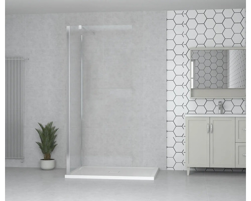 Salle de bain lumineuse avec douche à l''italienne, meuble sous-lavabo et revêtement mural décoratif.