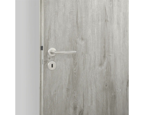 Porte intérieure grise avec poignée en métal et trou de serrure
