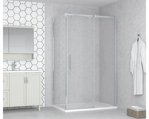 Cabine de douche avec porte coulissante dans une salle de bain lumineuse.