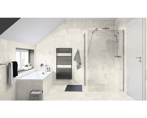 Salle de bains lumineuse avec baignoire, douche et radiateur
