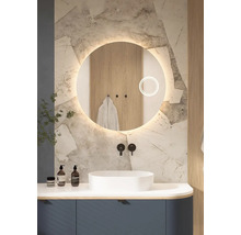 Salle de bains moderne avec miroir rond, lavabo et robinetterie