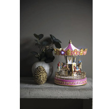 Dekoratives Karussell mit Beleuchtung, Vase und Tannenzapfen auf einem Tisch