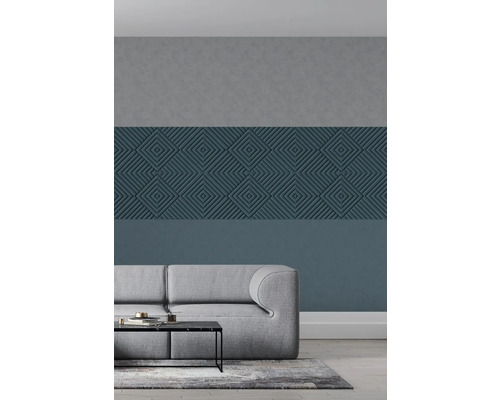 Salon avec canapé gris et panneaux muraux à motifs géométriques