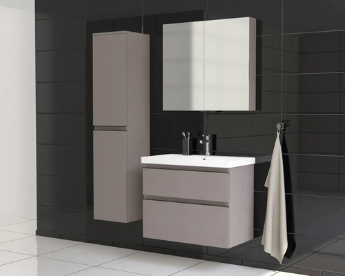Ensemble de salle de bains moderne avec meuble sous-lavabo, armoire de toilette et armoire haute sur fond de carreaux noirs