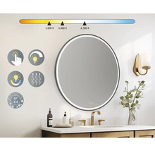 Miroir rond avec éclairage LED dans une salle de bains avec lavabo
