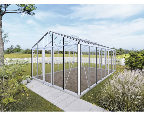 Serre avec murs en verre et cadre en aluminium dans le jardin