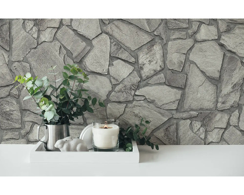 Décoration murale aspect pierre, décoration avec bougie, plante et lapin décoratif