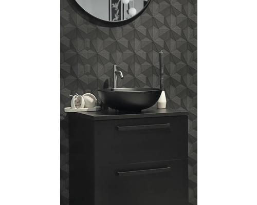 Salle de bains moderne avec meuble sous-lavabo noir, vasque à poser et décor mural géométrique.