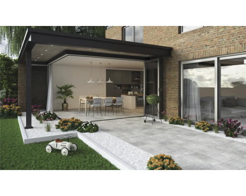 Terrasse avec dalles de terrasse, mobilier de jardin, barbecue et plantes