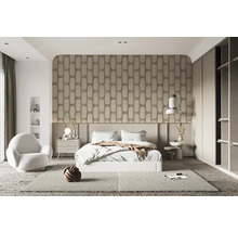 Chambre avec lit, table de chevet, fauteuil et décoration dans un design clair et moderne.