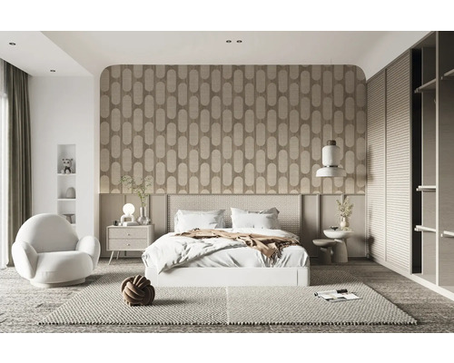 Chambre avec lit, table de chevet, fauteuil et décoration dans un design clair et moderne.