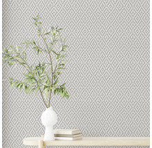 Gros plan d''un papier peint texturé avec un arrangement de plantes sur une table