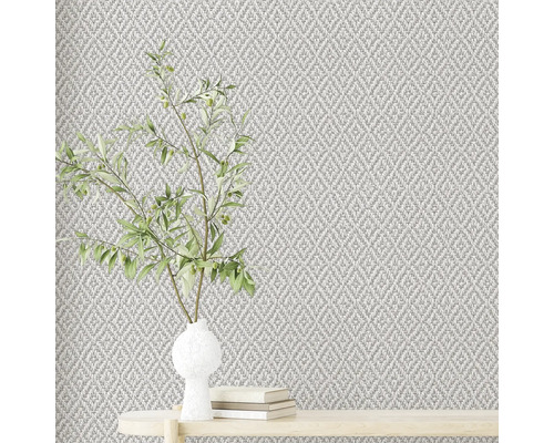 Gros plan d''un papier peint texturé avec un arrangement de plantes sur une table