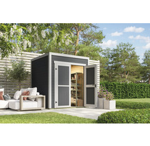 Abri de jardin avec double porte et étagères dans le jardin