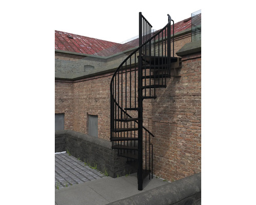 Wendeltreppe aus Metall vor einer Backsteinmauer
