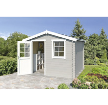 Abri de jardin avec fenêtre et porte ouverte dans le jardin