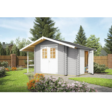 Abri de jardin en bois avec porte double et auvent dans le jardin