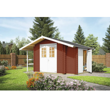 Abri de jardin rouge avec double porte et auvent dans le jardin