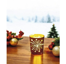 Photophore décoratif avec motif d''étoiles et de feux d''artifice sur une table avec décorations de Noël.