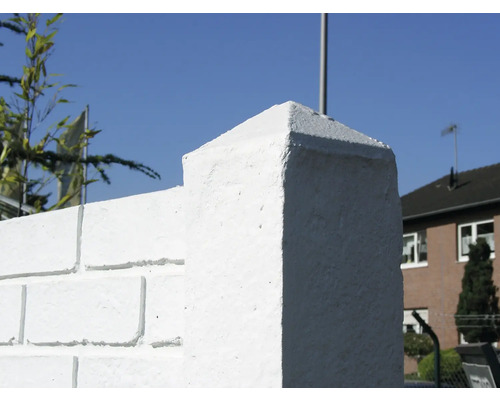 Gros plan d''un couvre-mur blanc sur un mur en briques