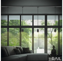 Wohnzimmer mit grauer Couch und Schienensystem-Leuchte