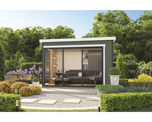 Scène de jardin avec abri de jardin, terrasse, mobilier de jardin et plantation