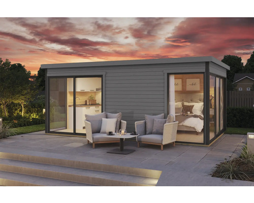 Maison de jardin moderne avec de grandes fenêtres et une terrasse avec mobilier de jardin