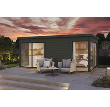 Maison de jardin moderne avec cuisine et chambre à coucher ainsi qu'un coin salon sur la terrasse.