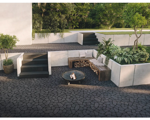 Espace extérieur avec pavés, coin salon, foyer et plantations