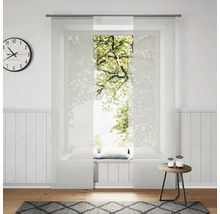 Pièce lumineuse avec rideaux coulissants, horloge et décoration