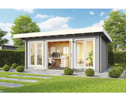 Abri de jardin moderne avec mobilier de bureau à l''extérieur sur une pelouse