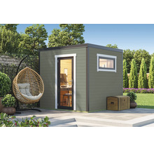 Abri de jardin avec fenêtre, porte et décoration dans un jardin