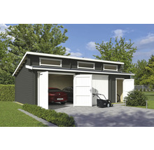 Abri de jardin spacieux avec deux portes de garage, voiture et tondeuse à gazon sur l'allée pavée