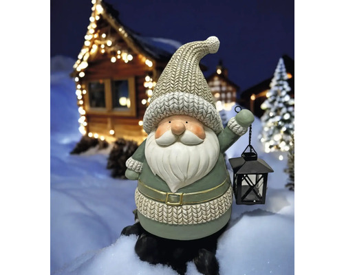 Dekofigur Weihnachtsmann mit Laterne im Winterdorf