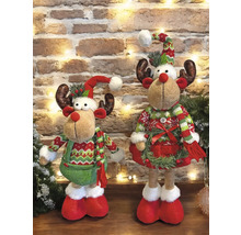 Zwei dekorative Rentierfiguren vor einer Ziegelwand