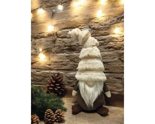 Dekorativer Weihnachtswichtel mit langem Bart und gestreifter Mütze als festliche Dekoration