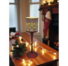 Dekorative Tischleuchte mit winterlichem Stadtmotiv auf einem Holztisch