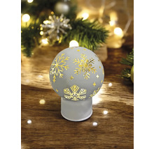 Objet de Noël décoratif avec motif de flocons de neige sur une table en bois