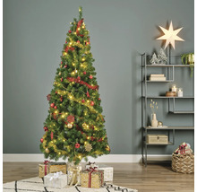 Sapin de Noël décoré avec des cadeaux dans le salon