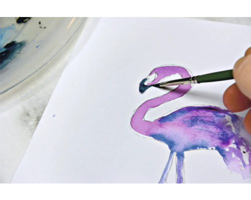 Peinture aquarelle d''un flamant rose avec un pinceau sur papier