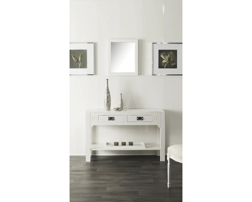 Salon décoratif avec console blanche, miroir et photos encadrées au mur