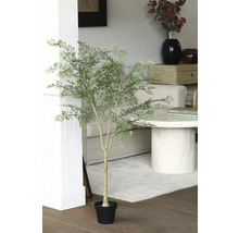 Plante artificielle décorative avec des feuilles vertes dans un pot noir