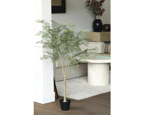 Plante artificielle décorative avec des feuilles vertes dans un pot noir